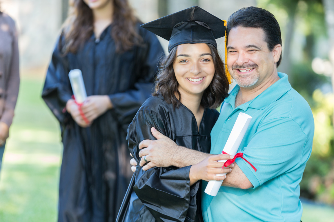 Proud father with college graduate