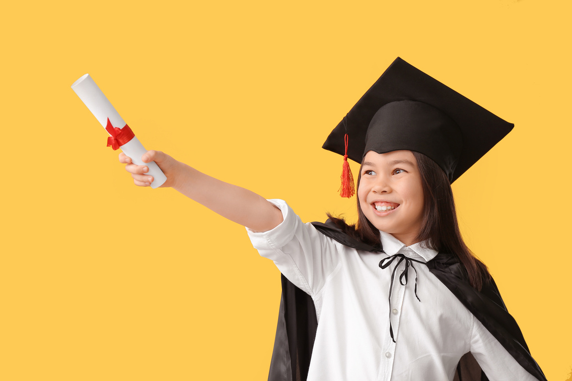 Little Girl in Graduation Hat and with Diploma
